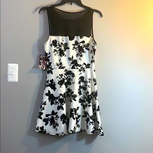 No rips, new, black flower design, mesh on the top